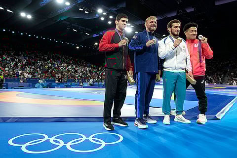 Paris Olympics men's freestyle 74kg wrestling: Albania's Chermen Valiev, bronze, Kyle Douglas Dake, of the United States, bronze, Uzbekistan's Razambek Salambekovich Jamalov, gold, Japan's Daichi Takatani, silver